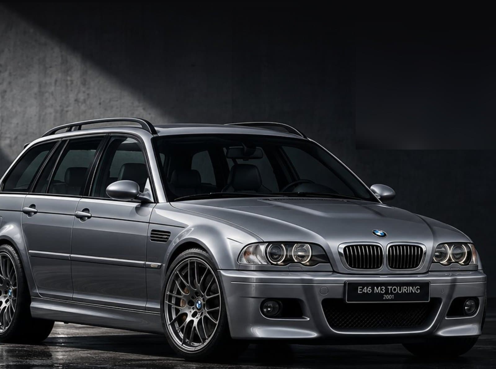 Silver BMW E46 M3 Touring in a dark studio